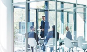 Full length shot of a group of corporate businesspeople meeting in the boardroom